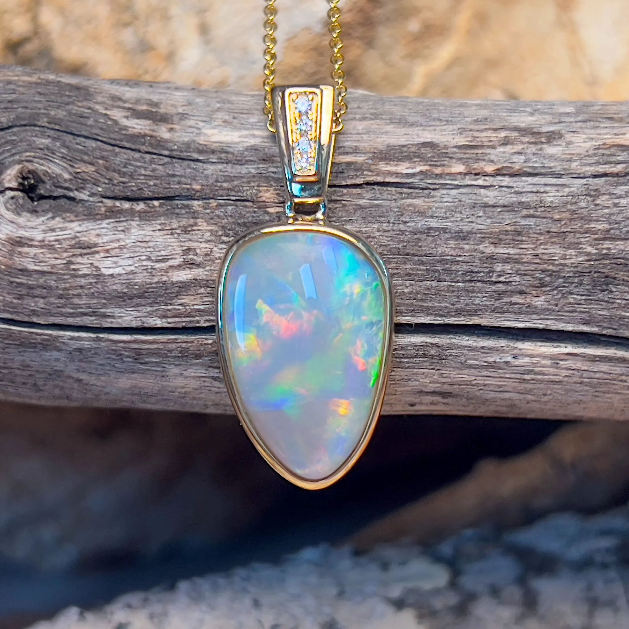 14kt Yellow Gold Black Opal triangular shape pendant with diamonds