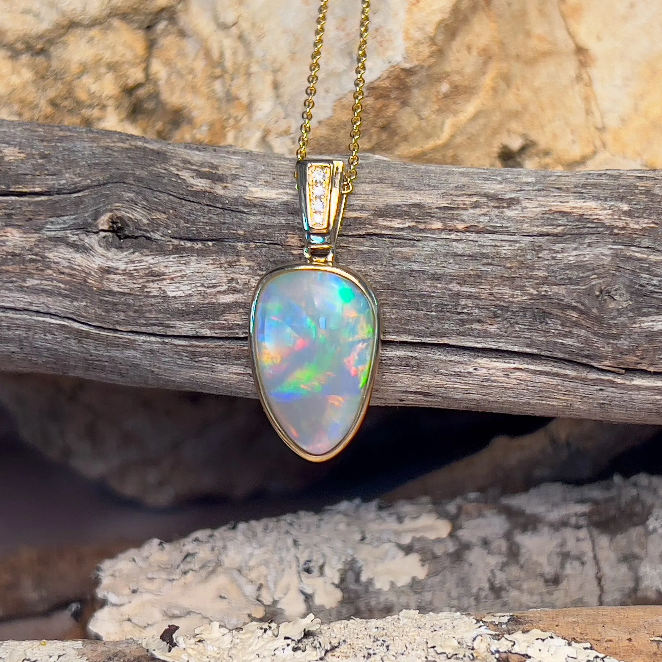 14kt Yellow Gold Black Opal triangular shape pendant with diamonds