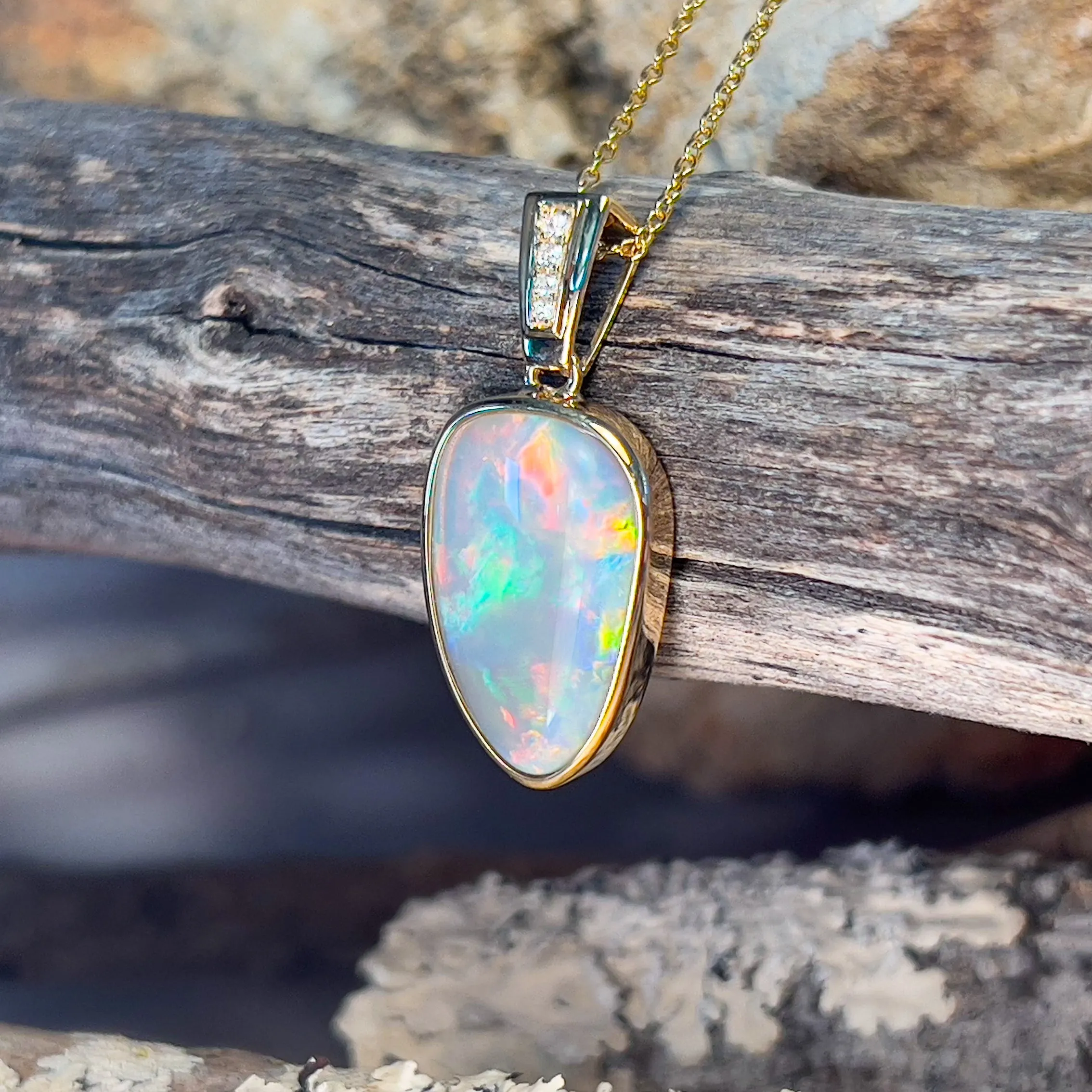 14kt Yellow Gold Black Opal triangular shape pendant with diamonds