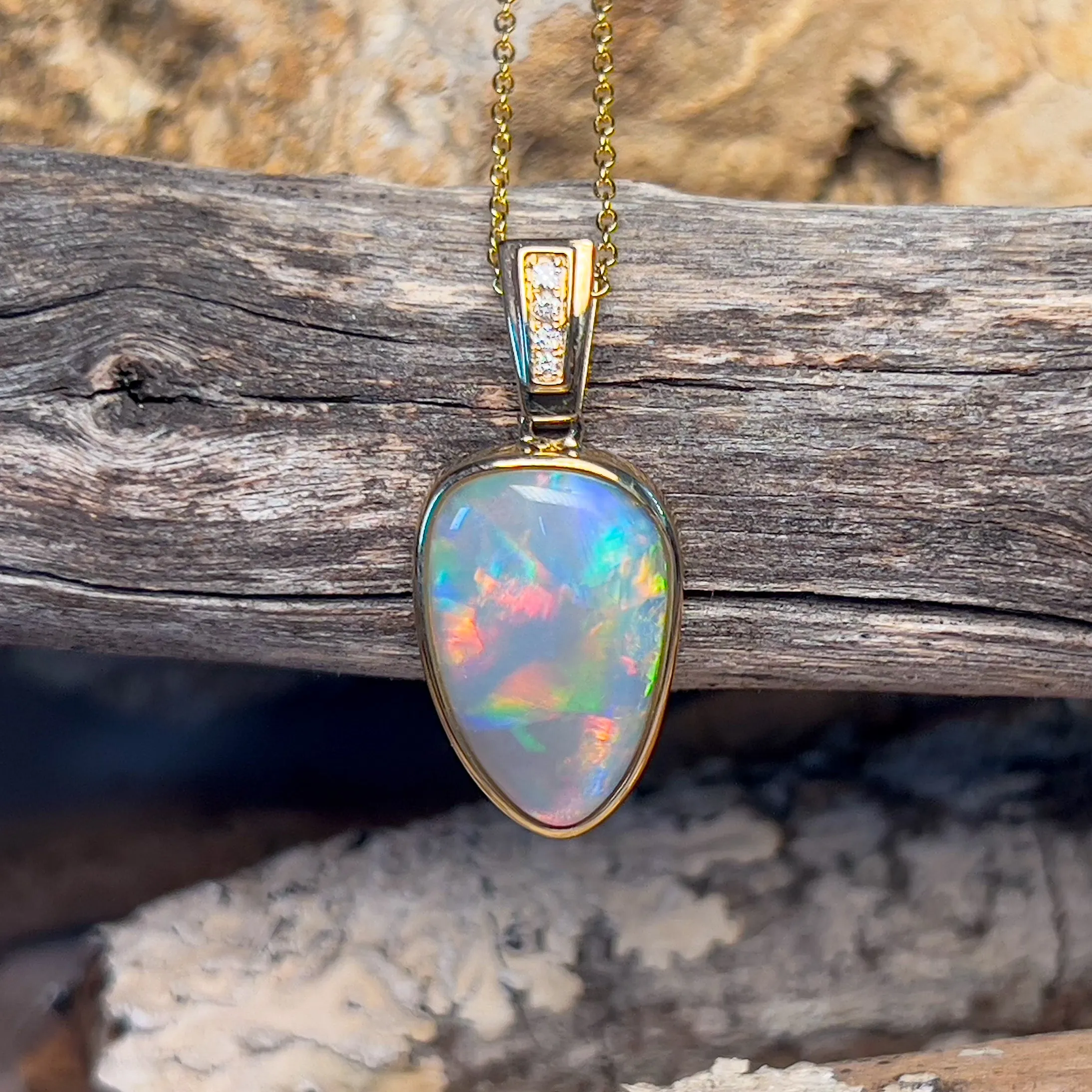14kt Yellow Gold Black Opal triangular shape pendant with diamonds
