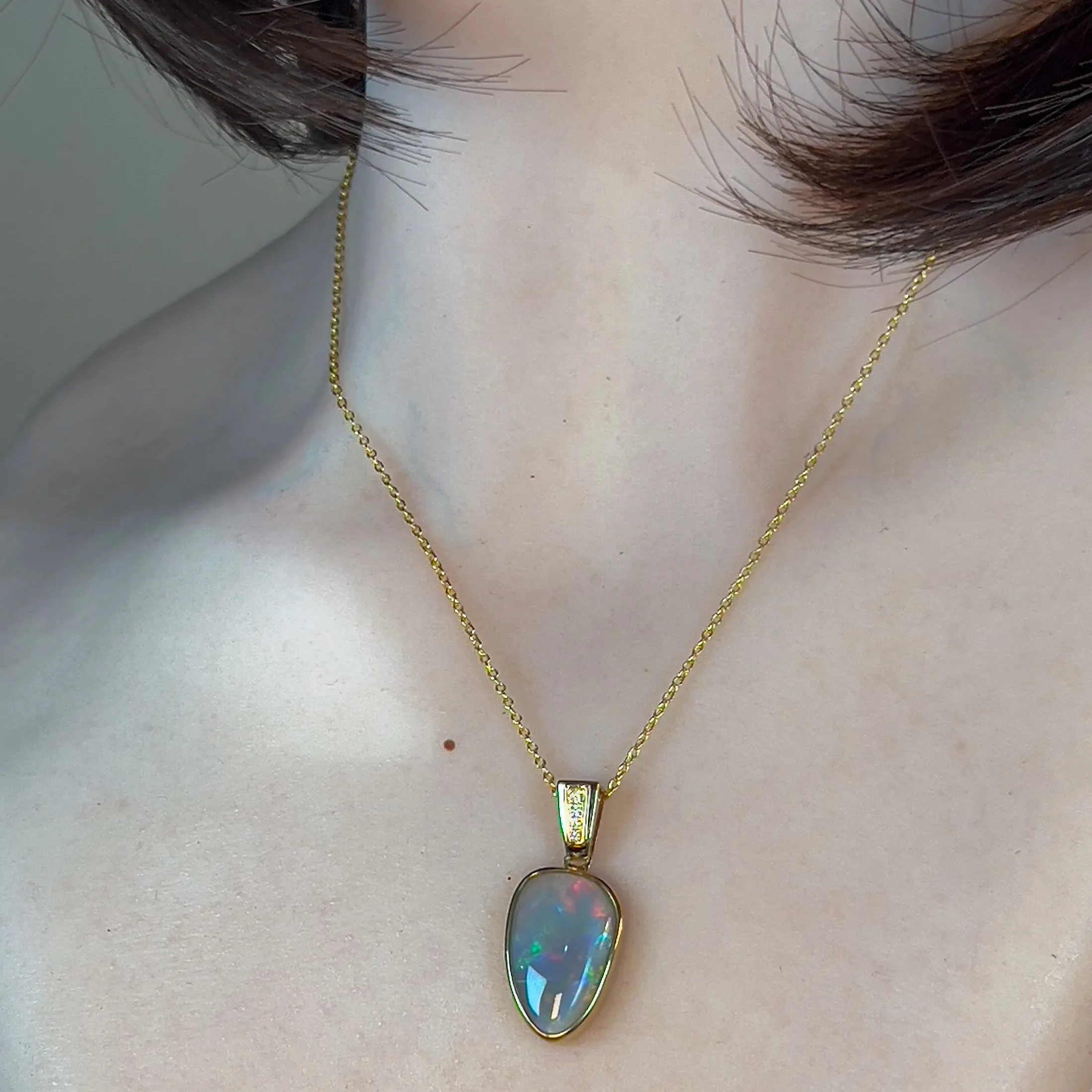 14kt Yellow Gold Black Opal triangular shape pendant with diamonds