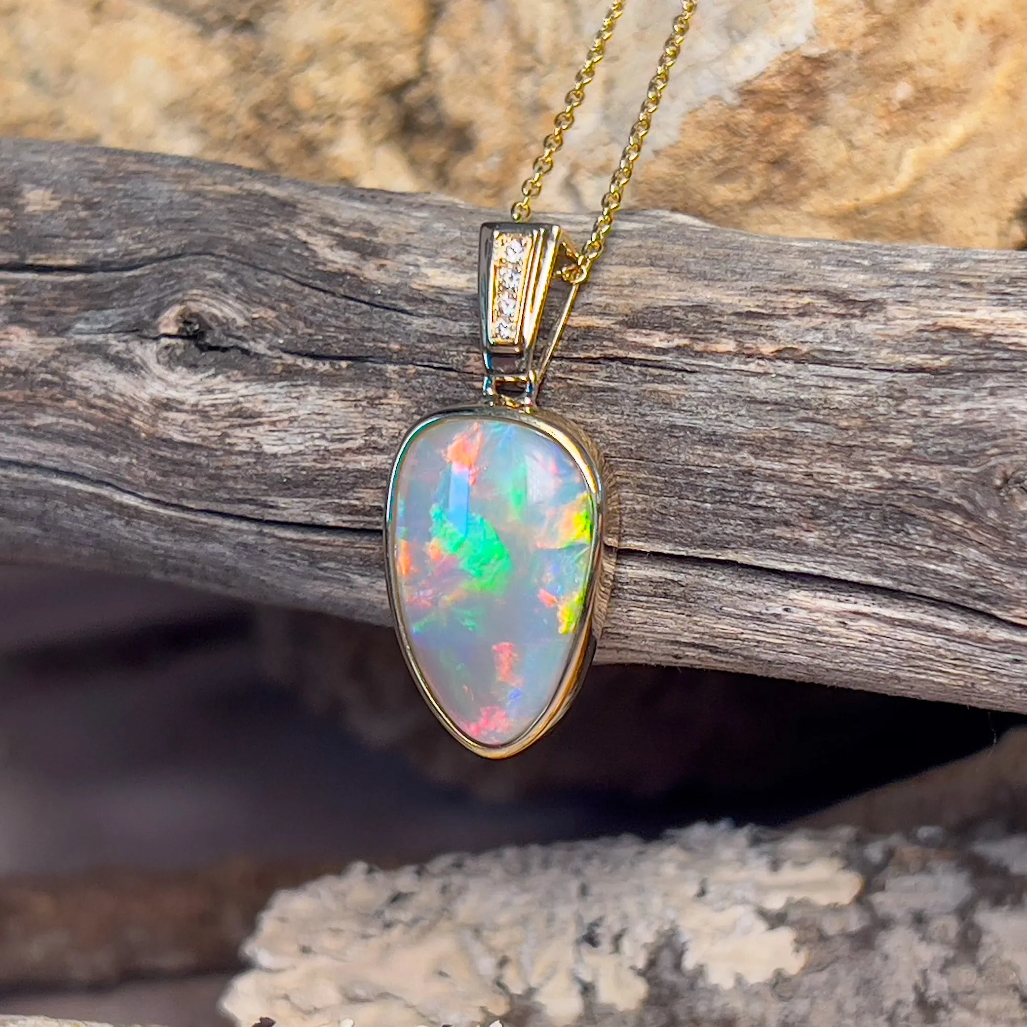 14kt Yellow Gold Black Opal triangular shape pendant with diamonds