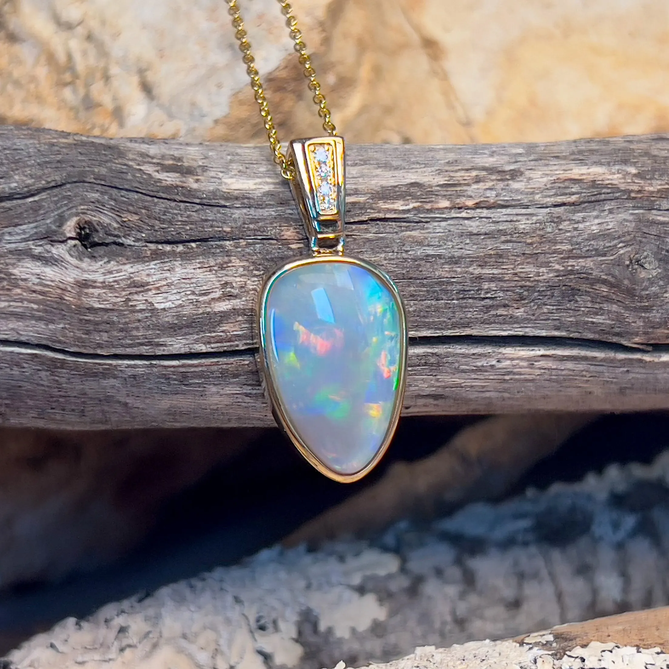 14kt Yellow Gold Black Opal triangular shape pendant with diamonds