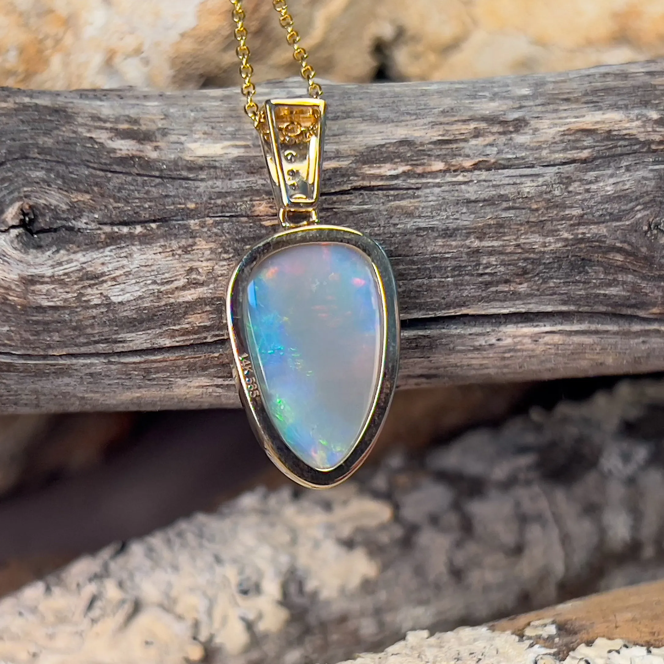 14kt Yellow Gold Black Opal triangular shape pendant with diamonds